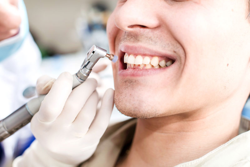 Patient receiving a professional dental cleaning