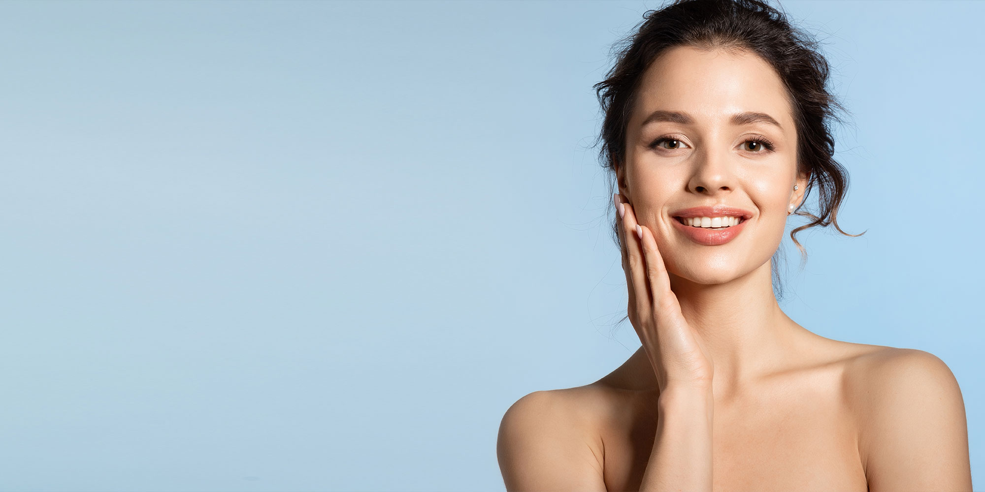 Young woman enjoy smooth skin and touching cheek with hand
