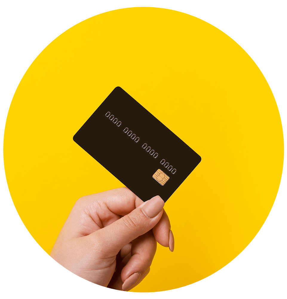 hand holding credit card on yellow background
