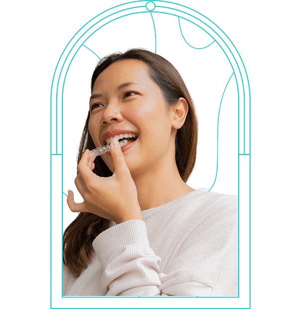 close up young asian woman smiling with hand holding dental aligner retainer